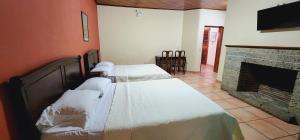 Letto o letti in una camera di Hotel Alsacia