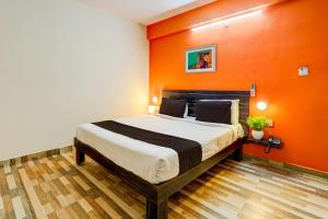 A bed or beds in a room at OYO Pmr Elitestay Hotel Near Ascendas Park Square Mall