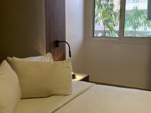 Katil atau katil-katil dalam bilik di Guided Hospitality - Luxury Accommodations
