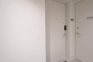 a white door in a room with a doorframe at Brand New Apartment in Brickell with parking in Miami