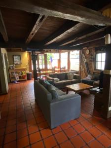 a living room with couches and a table at El Andaluz in San Martín de los Andes