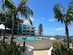 a view of the pool from the balcony of a resort at Prime Position – Dream Holiday Unit in Caloundra!! in Caloundra