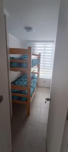 Ένα ή περισσότερα κρεβάτια σε δωμάτιο στο Costa Marina hermoso departamento +27 φωτογραφίες