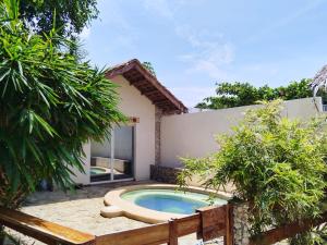 a pool in the backyard of a house at Tepanee Beach Resort in Malapascua Island