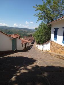 an empty street in a village with houses at Hostal central in Villa de Leyva