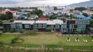 an aerial view of a building in a city at Zensala Riverpark Resort-SHA Extra Plus in Chiang Mai