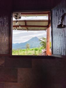 a window in a room with a view of a mountain at Casa Torre Eco- Lodge in Fortuna
