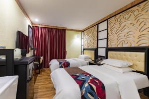 Voodi või voodid majutusasutuse Guangzhou Bird Island Hotel toas