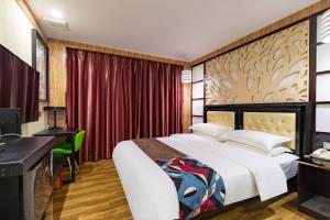 Voodi või voodid majutusasutuse Guangzhou Bird Island Hotel toas