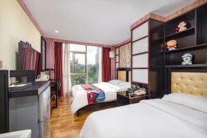 Voodi või voodid majutusasutuse Guangzhou Bird Island Hotel toas