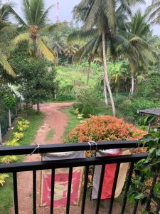 a view from the balcony of a resort with palm trees at Wasa Villa in Kalutara