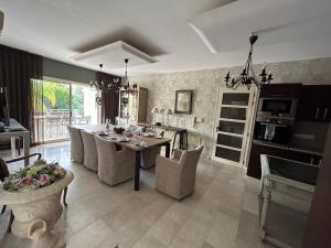 a kitchen and dining room with a table and chairs at SeaView 5 Bedroom Villa with Private Pool in Limassol