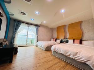 Postel nebo postele na pokoji v ubytování Ibiza Inn Kenting
