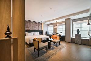 Arthur Hotel Luogang Xiangang Metro Guangzhou-Free Breakfast and Free Afternoon Teaにあるシーティングエリア