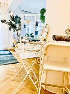 a dining room with a table and chairs at Blue City Center Boutique Apartment in Thessaloniki