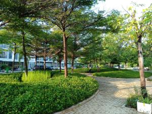 a park with trees and a brick walkway at C113 Home-1bedroom in Phnom Penh