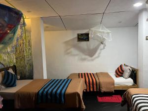 Postel nebo postele na pokoji v ubytování Noname Hostel And Cafe