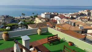 a view from the roof of a building with a bench at Hotel Mediterraneo in Roccella Ionica