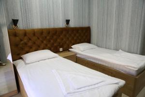 Ένα ή περισσότερα κρεβάτια σε δωμάτιο στο Luxor Rabath