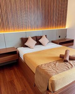 a bedroom with two beds and two night stands at The Kayuri in Canggu