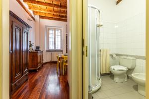 a bathroom with a toilet and a sink at Duomo-Porta Romana "Casa del Pittore" in Milan