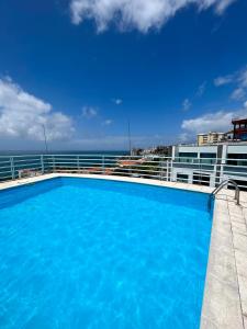 a swimming pool on the deck of a cruise ship at Lido Casa by Olá Madeira in Funchal