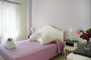 Posteľ alebo postele v izbe v ubytovaní Triantafilia Guesthouse