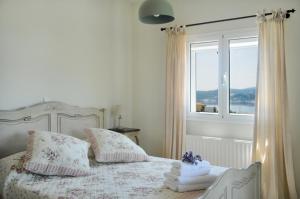 Posteľ alebo postele v izbe v ubytovaní Triantafilia Guesthouse