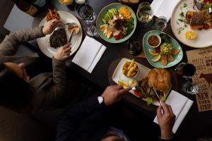 a group of people sitting at a table eating food at Heidelberg Marriott Hotel in Heidelberg