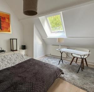 En eller flere senge i et værelse på Le cottage de David