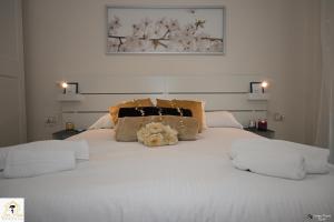 Ένα ή περισσότερα κρεβάτια σε δωμάτιο στο Inn Pisa Rentals - Downtown Cozy Apartment