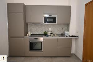 Η κουζίνα ή μικρή κουζίνα στο Inn Pisa Rentals - Downtown Cozy Apartment