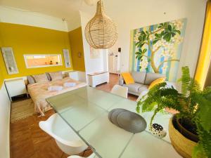 A bed or beds in a room at The Beachhouse Apartments