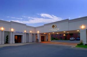 a front view of a hotel with a parking lot at DoubleTree by Hilton Hotel Grand Rapids Airport in Grand Rapids