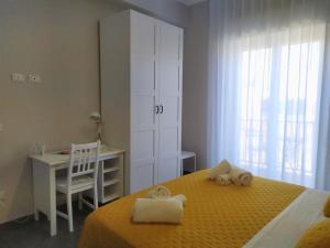 Ένα ή περισσότερα κρεβάτια σε δωμάτιο στο La Casa di Elisa