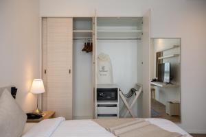 Postel nebo postele na pokoji v ubytování Kantary Hotel Banchang