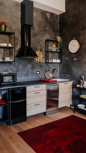 a kitchen with a stove and a stove top oven at Morandini Apartments in Čakovec