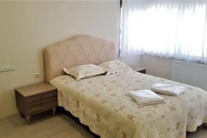 a bedroom with a bed with two pillows on it at 10 Central Location, Close To Beaches And Anywhere in Antalya
