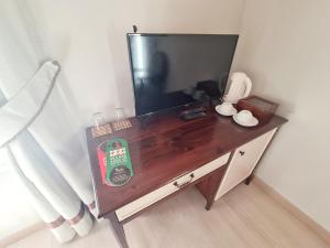 Телевизор и/или развлекательный центр в SOFIA BOUTIQUE HOTEL