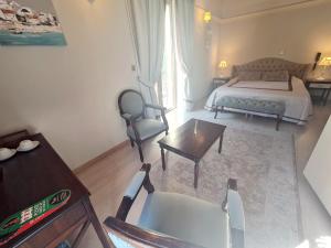 Кровать или кровати в номере SOFIA BOUTIQUE HOTEL
