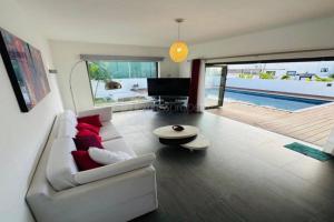 a living room with a white couch and a table at The view of the West in Albion