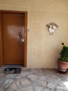 a door to a building with a mouse on the wall at Studio 2 in Ayia anna