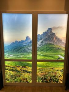 a window with a view of a mountain view at SKY Hotel Cloppenburg in Cloppenburg