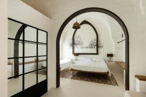 Postel nebo postele na pokoji v ubytování AL PALAZZO La Dimora by Apulia Hospitality