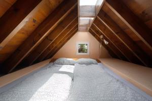 a bedroom with two beds in a attic at Casa Verde in Teguise