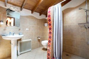a bathroom with a sink and a toilet at Casa Verde in Teguise