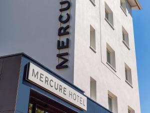 a hotel sign on the side of a building at Mercure Toulouse Aeroport Blagnac in Blagnac