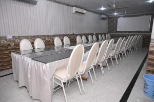 a conference room with a long table and chairs at Hotel Serina Inn in Kalar Goth