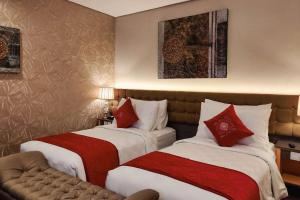 Rúm í herbergi á Ramada by Wyndham Yogyakarta