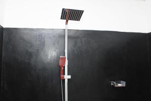 a black wall with a street light on it at Sigiri Gayani Home Stay in Sigiriya